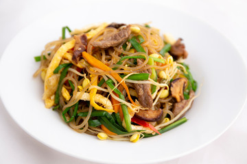 Stir fried Korean glass noodle with soy sauce called Japchae