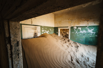Desert sand entering old abandoned building and decay