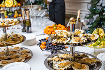 Fresh open oyster on a white plate. in the restaurant appetizer