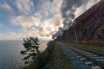 The steam engine traveled by rail along the shore of Lake Baikal