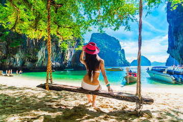Traveler woman in bikini relaxing on swing joy nature scenic beach Lao Lading island Krabi, Famous place tourist travel Phuket Thailand summer holiday vacation trip, Tourism beautiful destination Asia