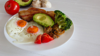 Ketogenic diet breakfast closeup on white table.