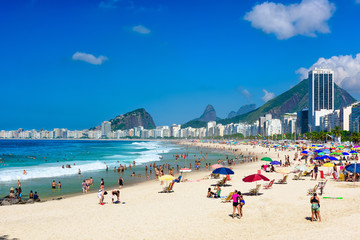 Obraz premium Leme and Copacabana beach in Rio de Janeiro, Brazil. Copacabana beach is the most famous beach in Rio de Janeiro. Sunny cityscape of Rio de Janeiro