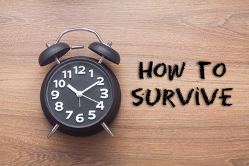 How to survive -  Motivation advice handwriting with clock