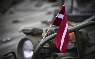State flag of Latvia on military armored vehicle