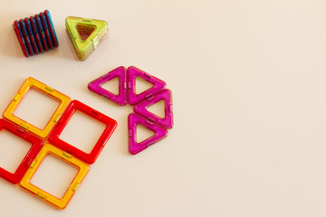 flat lay kids. Children's Magnetic construction toy for children. development of motor skills, thinking and imagination. Construction of multi-colored parts. children's game on a white background.