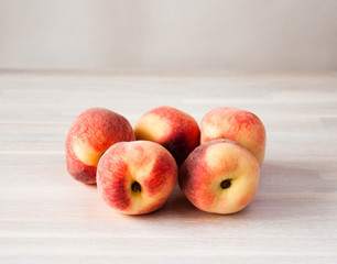 Ripe fresh peach fruits whole on white. Harvesting, healthy food, fresh fruit concept