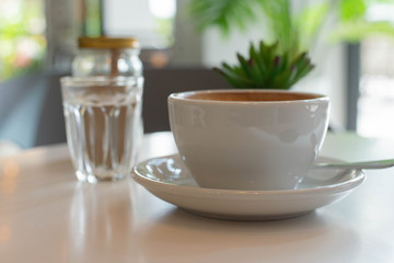 a cup of coffee on table