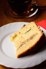 sponge cake on a white plate on a wooden background