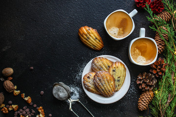Madeleine cookies, sweet dessert and coffee on the table (delicious pastries, sweets) menu concept. food background. top view. copy space
