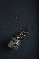 Peas in a glass jar on Dark moody black with grey concrete texture or background. With place for text and image