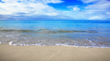 Caribbean sea and blue clouds sky. Travel background.
