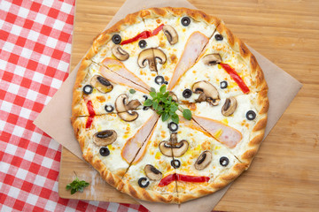 Mushroom pizza with various ingredients, decorated with Basil, an assortment of traditional Italian fast food