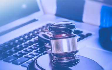 Gavel on laptop computer.