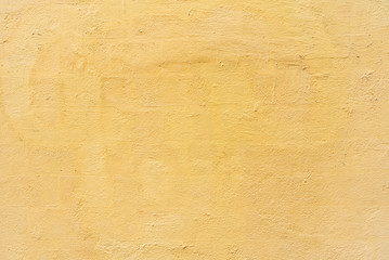 Texture of old yellow cement concrete wall