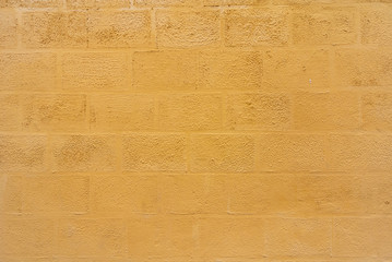Texture of old yellow cement concrete wall