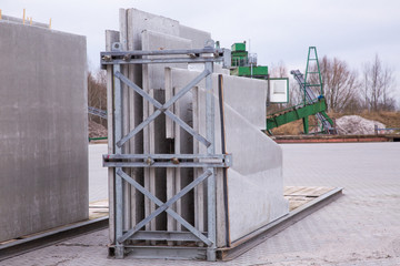 Picture of precast concrete walls ready for shipping in transport racks in panel stock