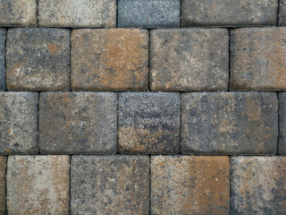 Bricks, paving stones, stacked as a wall, as a background