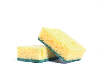A yellow kitchen sponge isolated against white background in different poses.