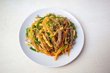 Stir fried Korean glass noodle with soy sauce called Japchae