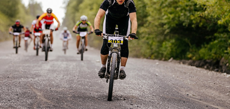 Group Cyclists Riders Riding On Gravel Road Cycling Competition