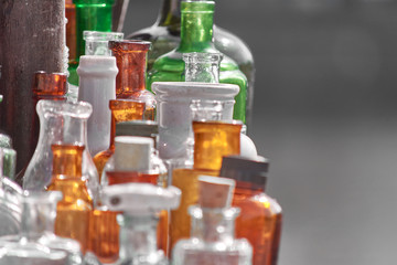 Collection of glass multi-colored vintage perfume bottles.
