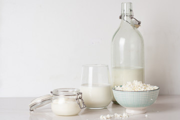 different milk products on a white background