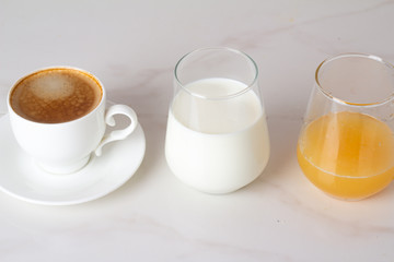 coffee, juice and milk on a white background