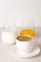different breakfast drinks: coffee, juice and milk