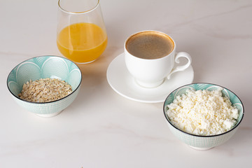 cottage cheese, oatmeal, coffee and juice for breakfast