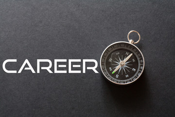Career word written on black background with compass