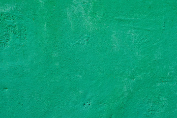 Cement wall.Green background with holes