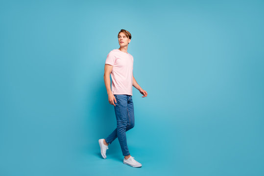 Full Length Profile Side Photo Of Serious Gorgeous Youth Guy Have Free Time Go Walk Through Part Look Copy Space Wear Modern Clothes Sneakers Isolated Over Blue Color Background