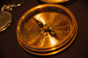  Many vintage compasses in showcase of the shop