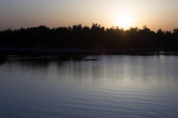 Fototapeta na wymiar beautiful sunset by the lake