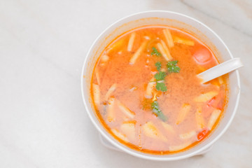 Photo of Seafood Tomyam soup in the white bowl - Thai food