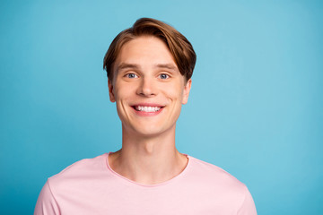 Close up photo of cheerful satisfied guy have rest spring relax enjoy weekends wear casual style outfit isolated over blue color background