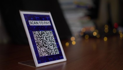 QR code payment display in the retail store. To use a QR code payment the consumers scans the QR...