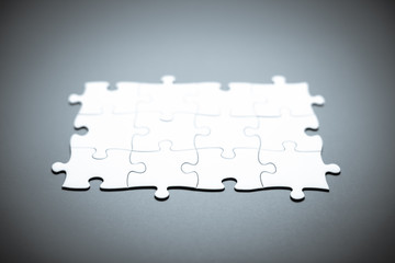 Jigsaw puzzle background with white pieces