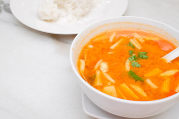 Photo of Seafood Tomyam soup in the white bowl - Thai food