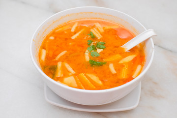 Photo of Seafood Tomyam soup in the white bowl - Thai food
