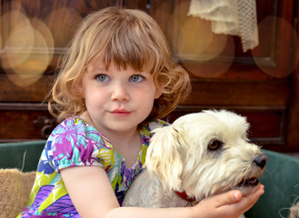 beautiful girl cuddling her dog