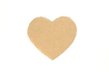Cardboard heart on a white isolated background. Stock photo for the day of St. Valentine with empty space for your text. For web, print, postcards and wallpaper