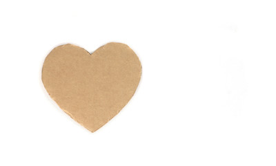 Cardboard heart on a white isolated background. Stock photo for the day of St. Valentine with empty space for your text. For web, print, postcards and wallpaper