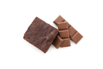 Chocolate cake slice and chocolate isolated on white background