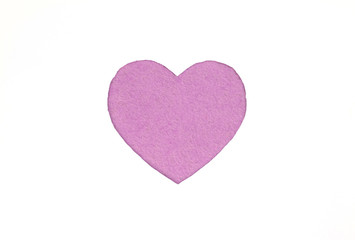 Оne felt violet heart on a white isolated background. Stock photo for the day of St. Valentine with empty space for your text. For web, print, postcards and wallpaper.