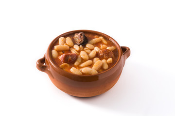 Typical Spanish fabada asturiana isolated on white background