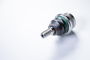New spare parts spherical ball joints of a suspension bracket of a car on a gray background