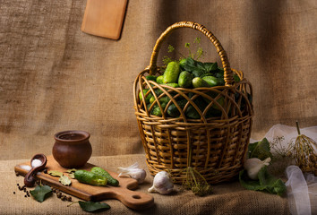 The process of preparing pickled cucumbers in the form of a still life with the main ingredients