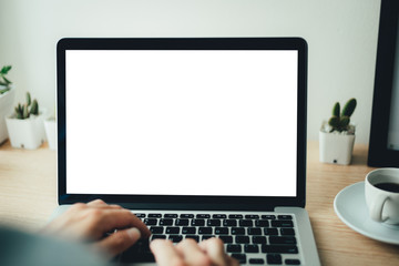 mockup image blank screen computer with white background for advertising text,hand man using laptop contact business search information on desk at coffee shop.marketing and creative design